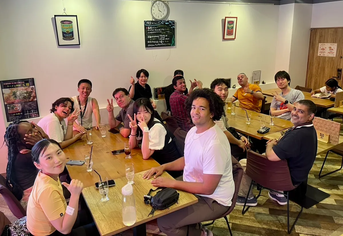Members smiling around the table