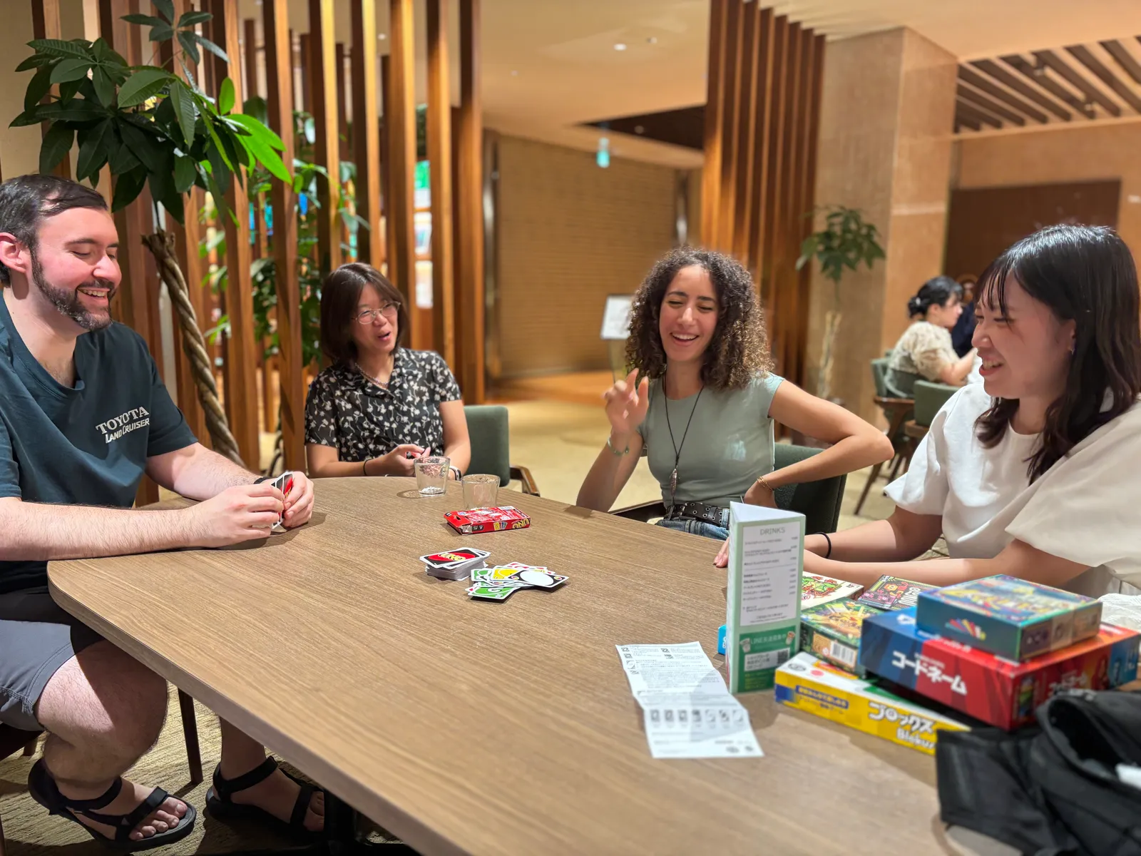 Members laughing over a card game